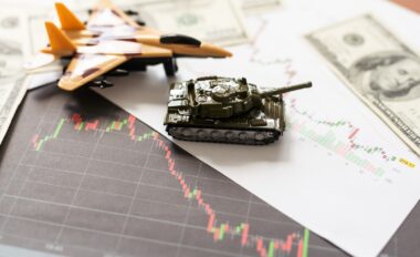 The,main,battle,tank,on,us,dollar,bill,banknotes,background.
